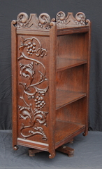 English Arts and Crafts revolving carved oak bookcase.  Grapevine design. 